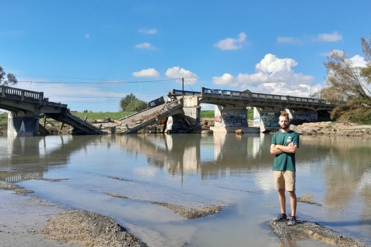 Tom Kay, Forest & Bird Freshwater Advocate, near collapsed Redclyffe Bridge after Cyclone Gabrielle. Image Chantal Pagel