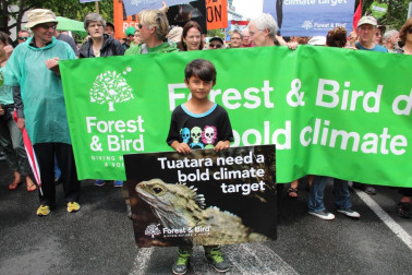 Forest & Bird at the Auckland climate march with young boy at the front