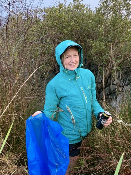 Kaya Freeman picking up rubbish at the 2019 Whau River Seacleaners event, Waitematā Harbour, Tāmaki Makaurau Auckland