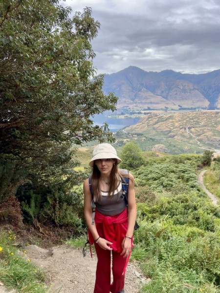 Nora Paicu, Forest & Bird Youth Ōtepoti Dunedin Hub Leader, hiking in the hills. Image supplied