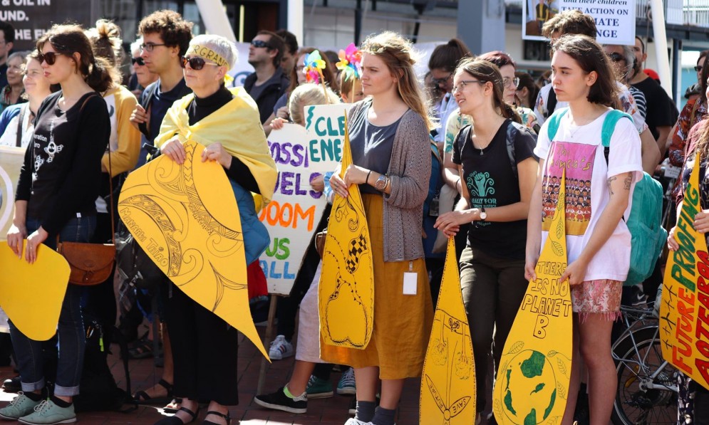 Forest & Bird Youth from Wellington stand in protest against oil.