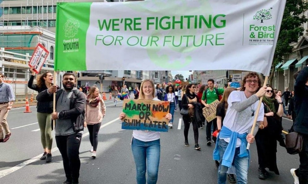 Kaya (centre) marching with Forest & Bird Youth members Pravneel Kumar (left, an Auckland member) and Connor Wallace (right, a Youth co-director) in the 2019 School Strike for Climate (SS4C), Tāmaki Makaurau Auckland