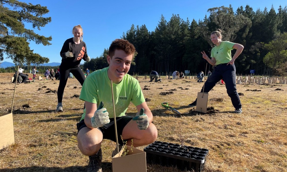 Nelson-Tasman hub youth members Evie (left) Nate (centre) & Maddy (right) at the Moturoa Rabbit Island community planting day. Credit Connor Wallace