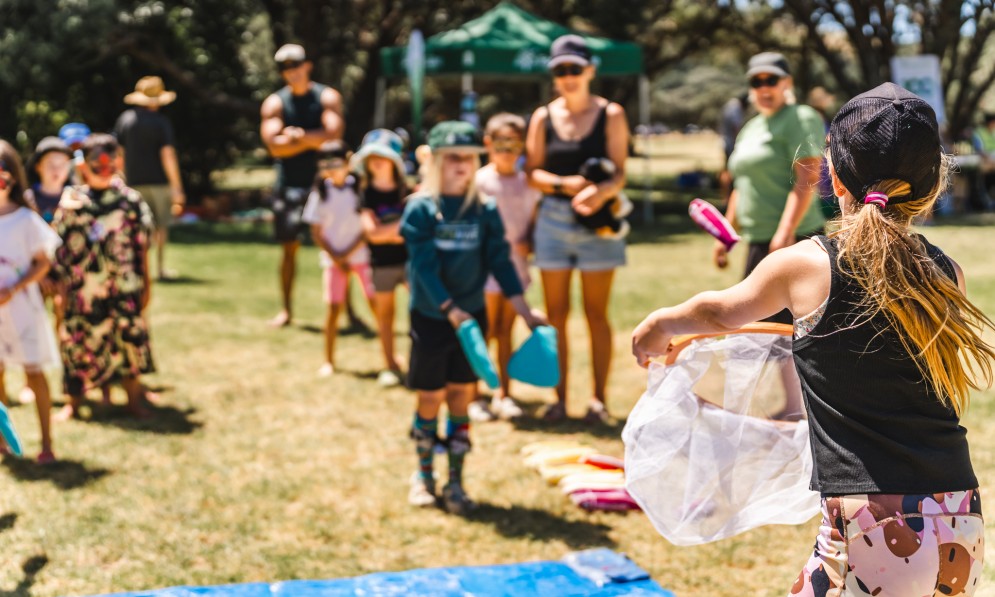Kids playing fish migration game. Credit Danni Yu
