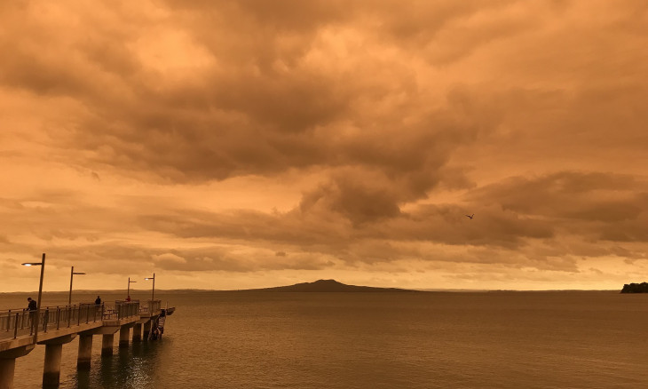 Smog from Australian bushfires turning the skyline over Rangitoto red