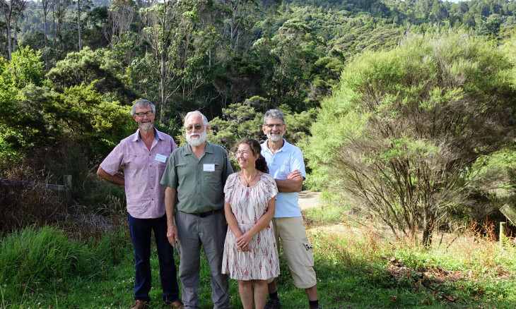 Waitākere branch members standing in the bush