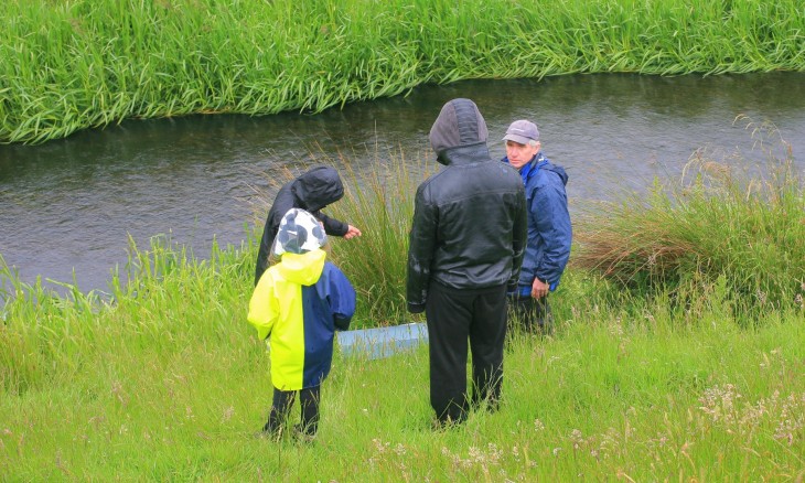 Group standing by stream 