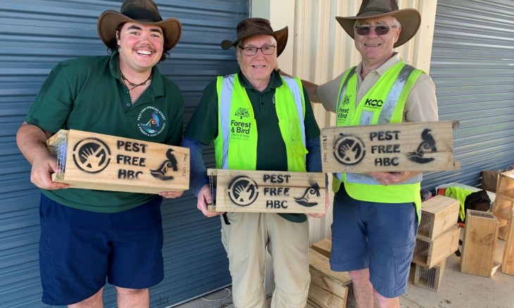 Pest free Hibiscus Coast Project volunteers and Charlie holding some traps