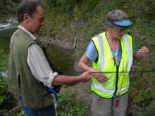 Brian and Julie removing debris from a mist-net