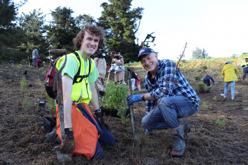 Connor, tree planting at Hosking Reserve, with Phil Goff. Image supplied.