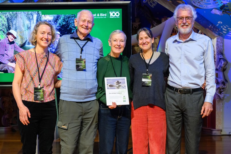 Ann and Basil Graeme receiving the Distinguished Life Member award 2023 (L to R: Kate Graeme, Forest & Bird Deputy President, Basil Graeme, Ann Graeme, Meg Graeme, Mark Hanger, Forest & Bird President)