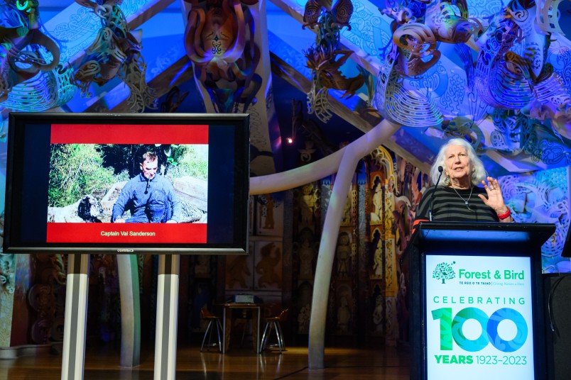 Dame Anne Salmond delivering the Sanderson Lecture July 2023 with Val Sanderson slide. Image Mark Coote